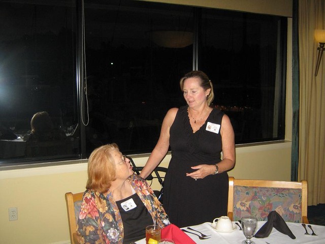 Kim Stinson visits with Lynn Courtney