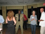 Gail Hunt Coleman enjoys a dance with Johnny Richardson alongside Nancy Darty Combs and Leo Mills