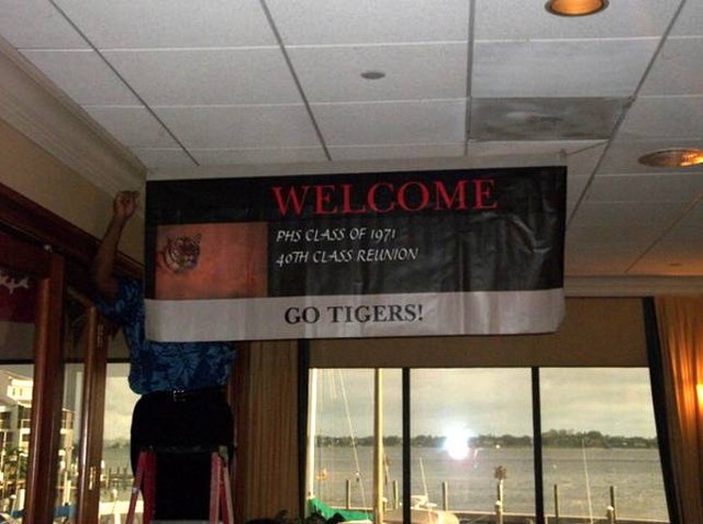 Class Banner donated by Veenie Bomar Goodson being raised for Saturday night