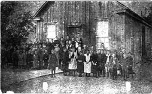 Black & White image of Palmetto's first schoolhouse